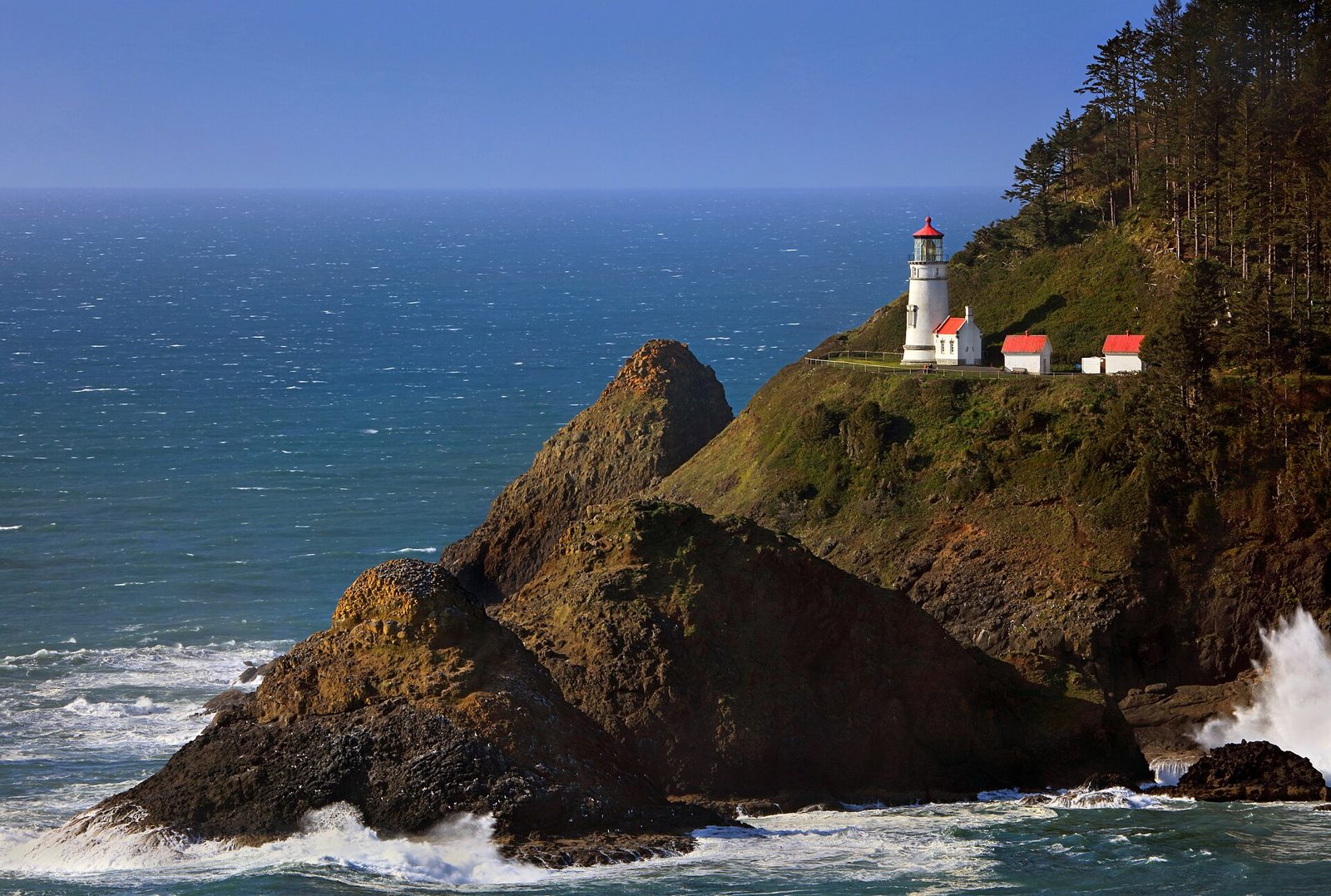 Heceta Head Lighthouse on its headland at evening