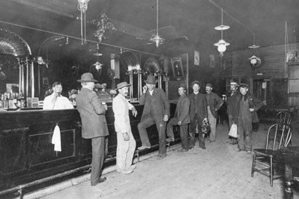 Patrons standing at the White Eagle saloon bar, about 1910
